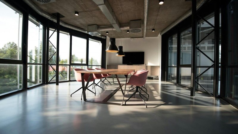 photo of dining table and chairs inside room